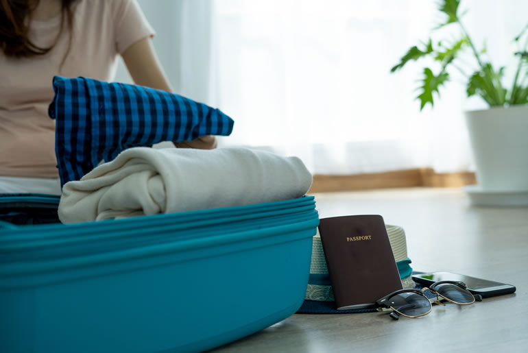 women are preparing clothes passports various belongings travel ingress bedroom compressed